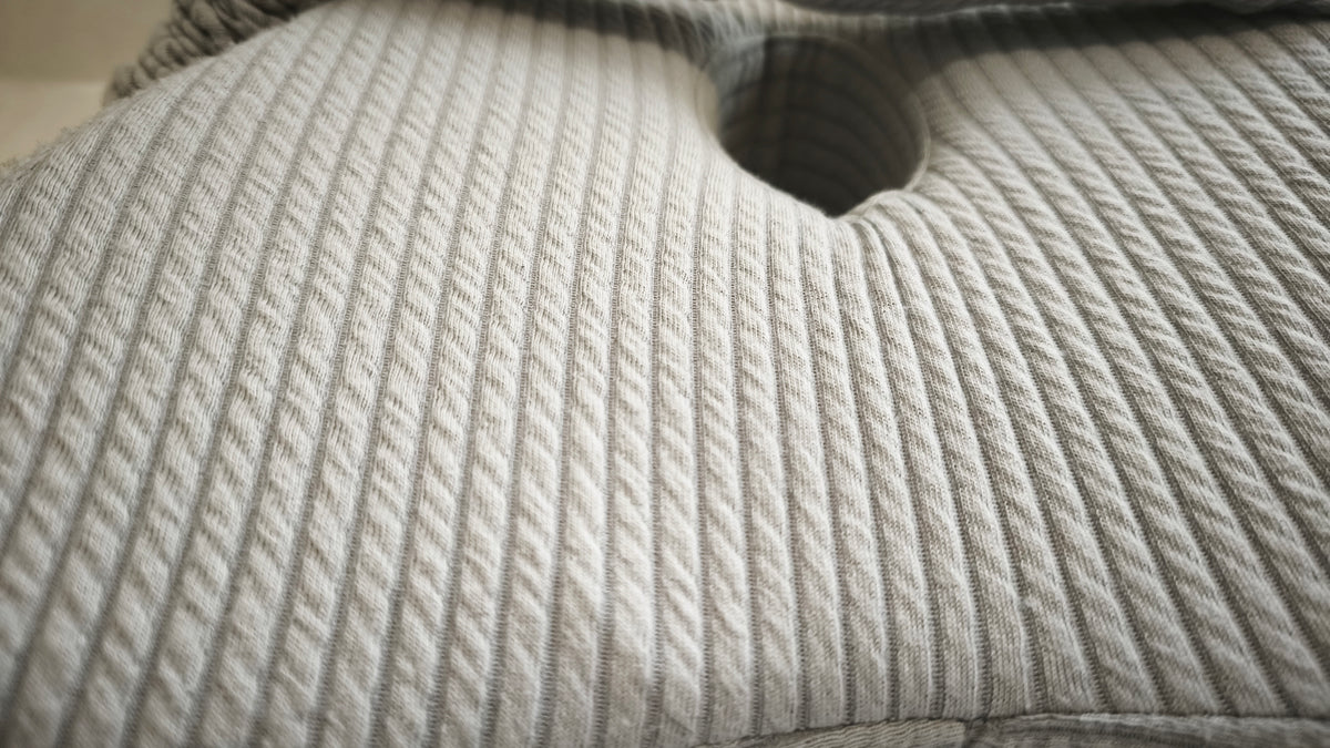 Close-up of the Butterfly Knee Pillow's ribbed-knit cover fabric