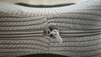 Close-up of the two-way zip on the Butterfly Knee Pillow's removable cover