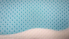 Close-up of the open-hole mesh top over the aqua cooling gel layer