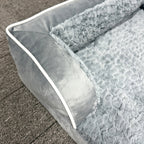 Close-up of the plush faux-fur sleeping surface, white piping and stitched Aveland leather-look patch
